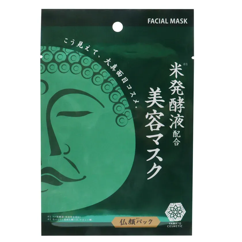 仏陀の顔が描かれた、緑色の美容マスクのパッケージ。
