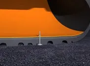 オレンジ色の物体の一部と、そこから突き出た白い棒のクローズアップ画像。