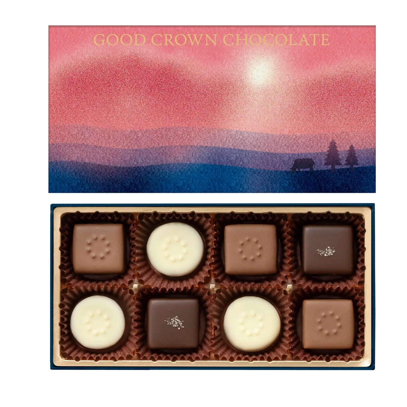 チョコレートの箱の写真。箱の上部には夕焼けのような風景が描かれ、下部には様々な形のチョコレートが並んでいる。