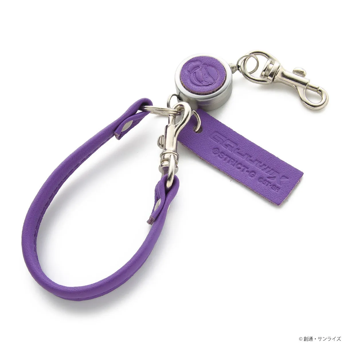 紫色のキーホルダー。キーホルダーには、紫色の革製のストラップ、ロゴが入った紫色のタグ、リール、銀色のクリップが付いている。