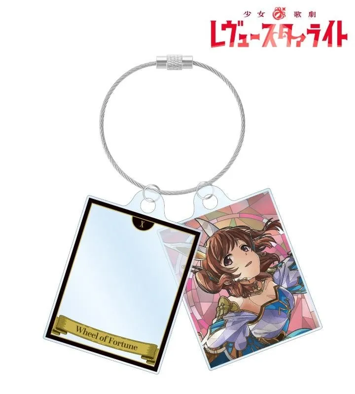 少女歌劇レヴュースタァライトのキャラクターが描かれたキーホルダー。片方には「Wheel of Fortune」の文字とカードの絵柄、もう片方にはキャラクターのイラストが描かれている。