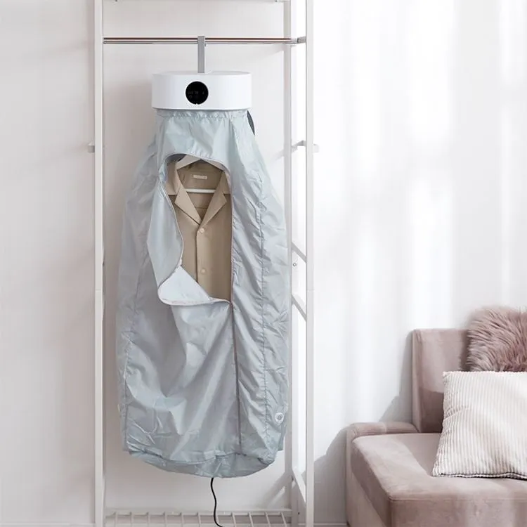 シャツが中に吊るされた衣類乾燥機が写っています