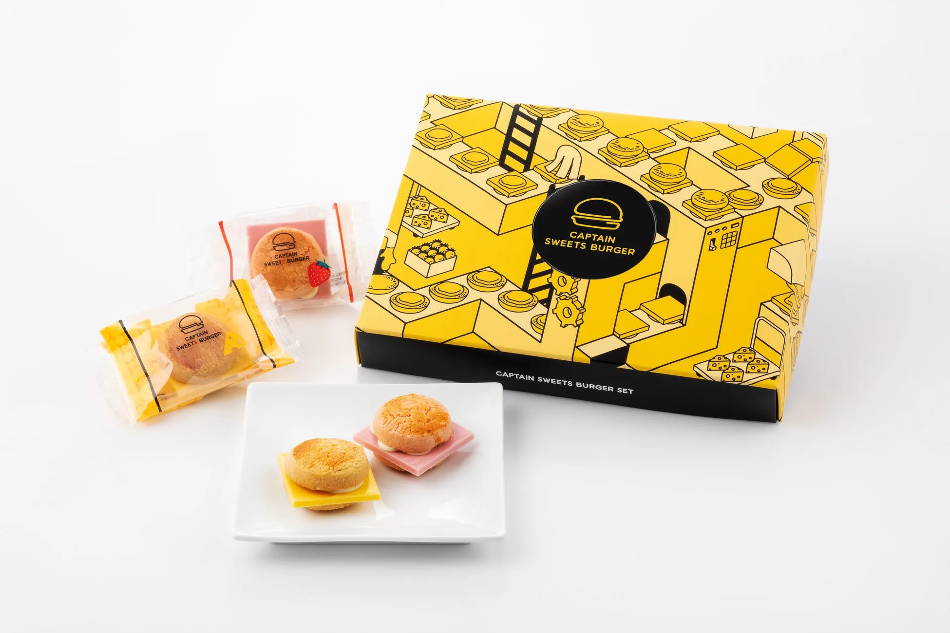 キャプテン スイーツ バーガーのセットの写真。箱、個包装されたお菓子、お皿に盛り付けられたスイーツバーガーが写っています。