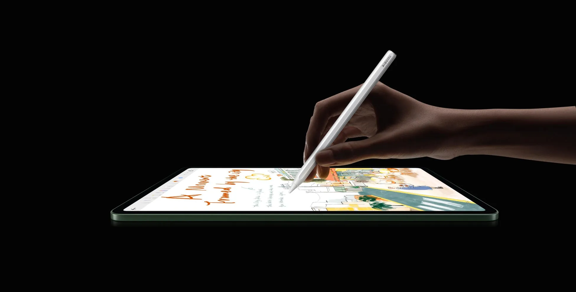 ペンでイラストを描いている手とタブレット